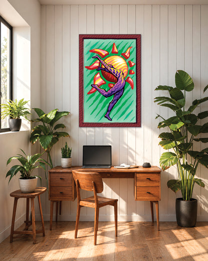 Sun Salutation art print above a wooden desk with a laptop, surrounded by houseplants in a sunny home office.
