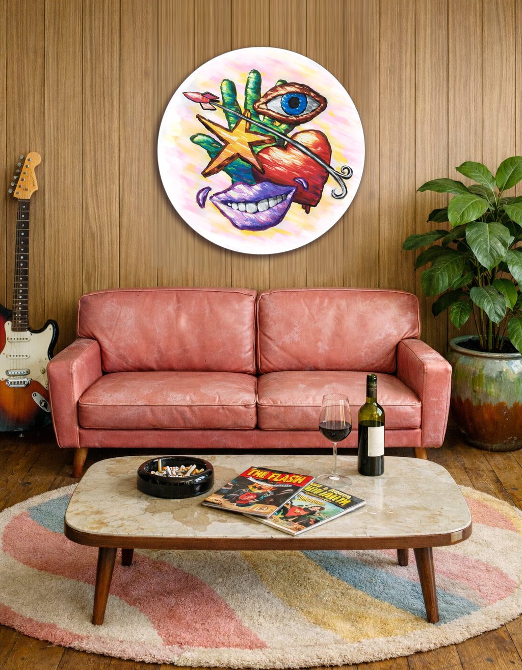 Colorful Hand Eye Heart Mouth Star canvas print displayed above a pink sofa