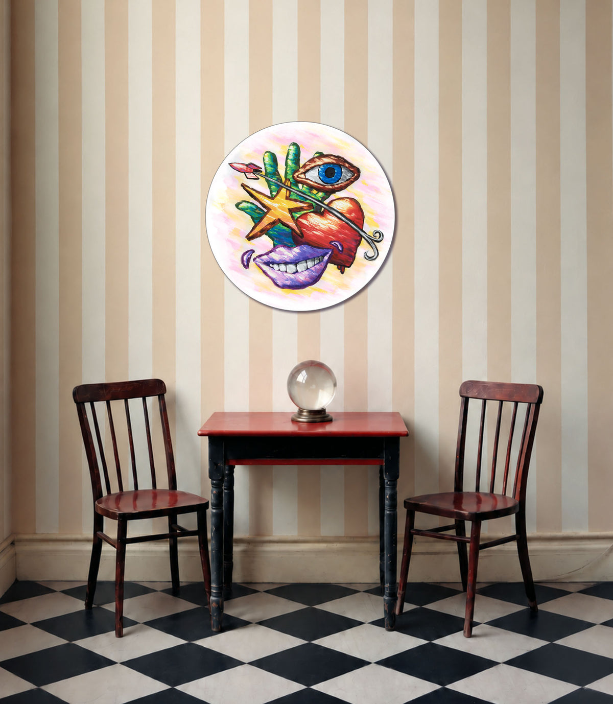 Hand Eye Heart Mouth Star round wall art displayed above a dining table between two chairs