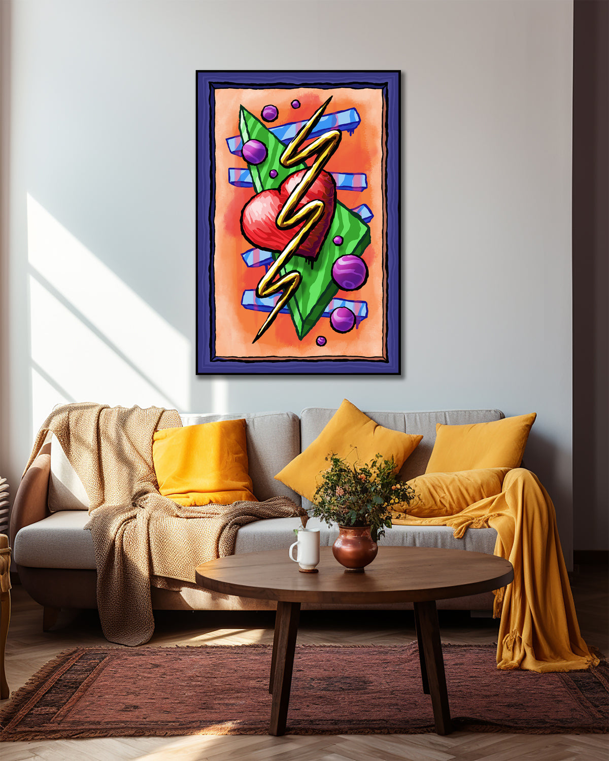 Zigzag Triangle Heart Dots art print above a gray sofa with yellow cushions and draped throws behind a round coffee table.
