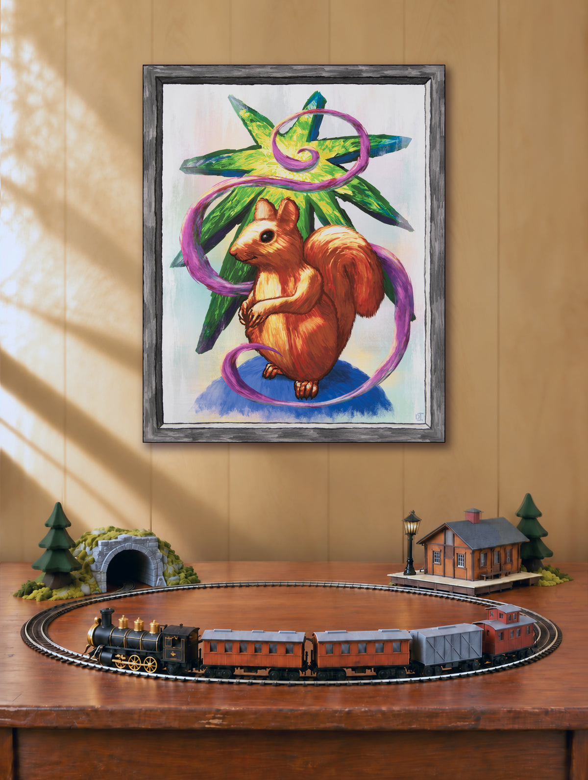 Star Squirrel canvas art print displayed above a model train table.